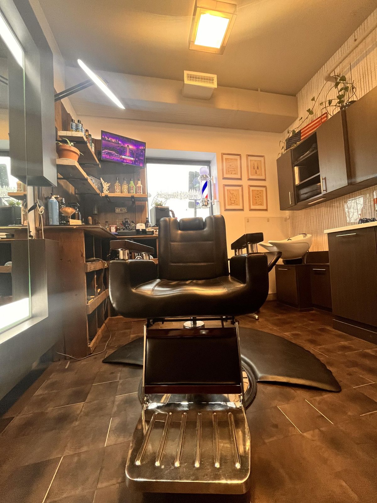 The one barber chair at Speakeasy, facing the mirror